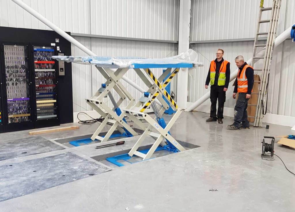 scissor lift installation in progress in the Hippo Motor Group facility