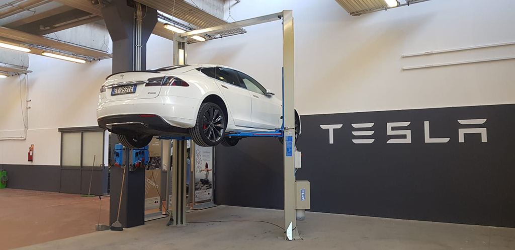 electric vehicle tesla on an OMCN lift